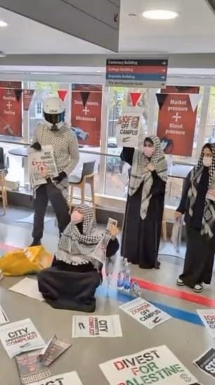 A group of people wearing masks and holding signs

AI-generated content may be incorrect.